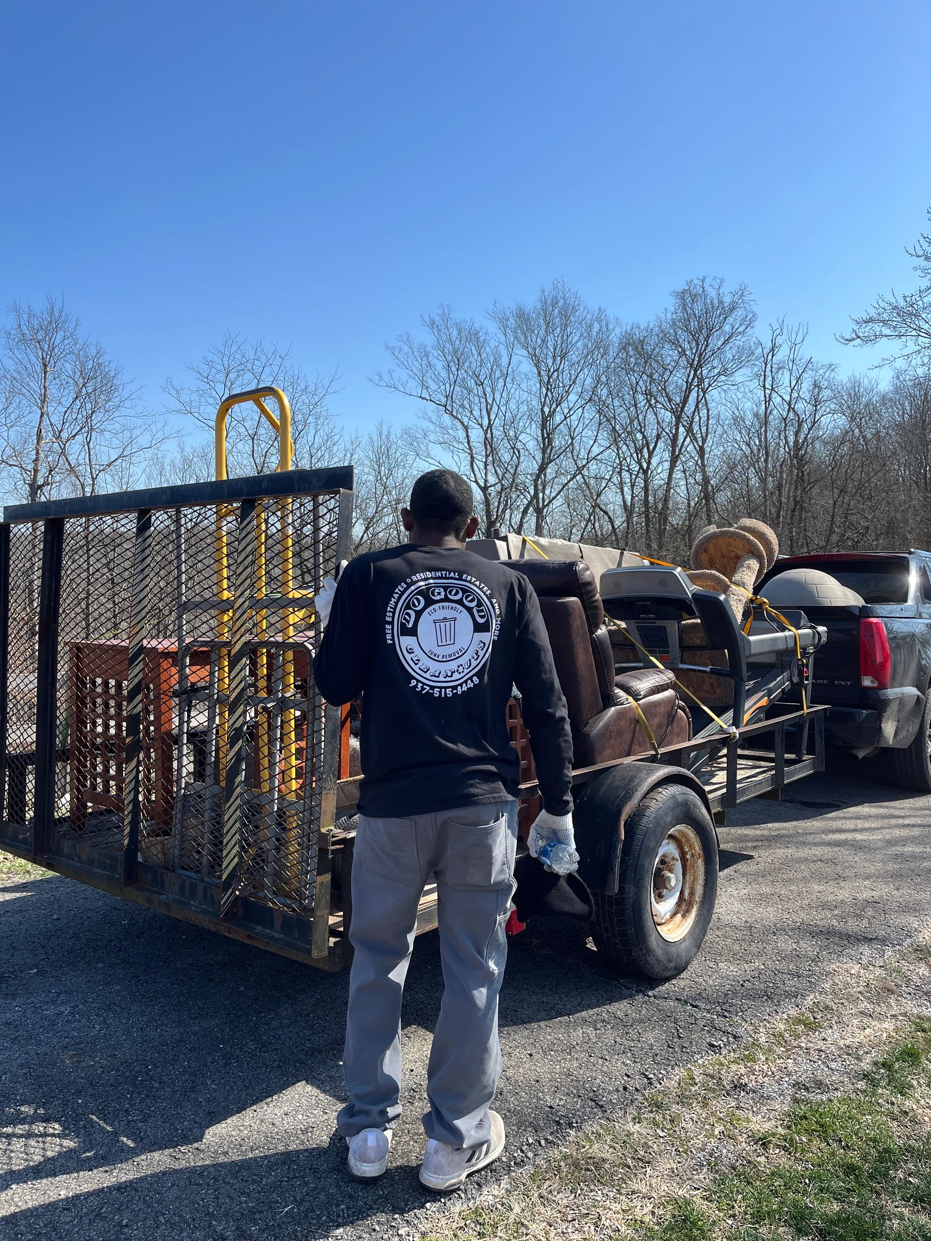 Do Good Cleanouts team member with utility trailer ready for a cleanout job