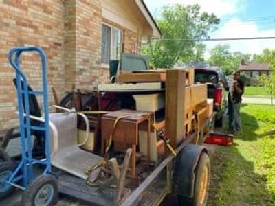 Do Good Cleanouts team loading items for removal